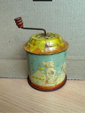 Vintage tin lithograph hand crank noise maker. 3 1/4” tall not with handle.